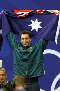 This is Ian Thorpe on the podium with the Australian flag, about to receive his gold medal.